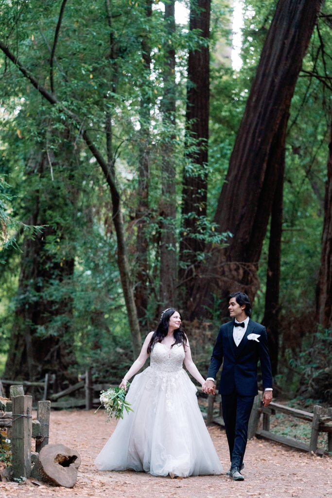 Destination wedding at henry cowell state park couple walking under the redwoods