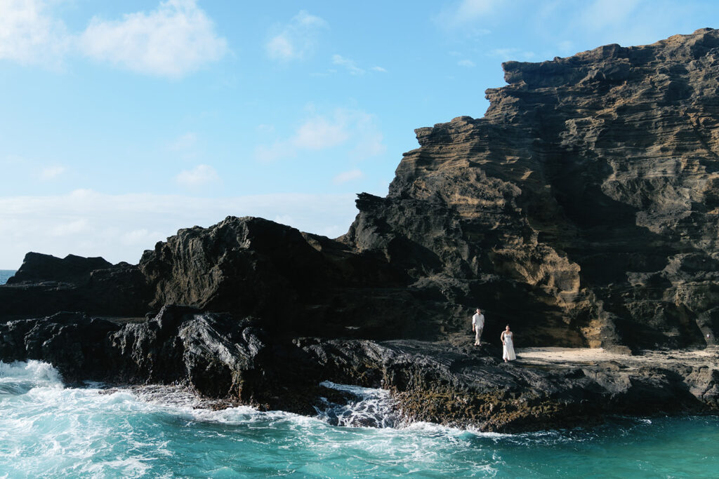 couple at the ocean posing for a hawaii elopement