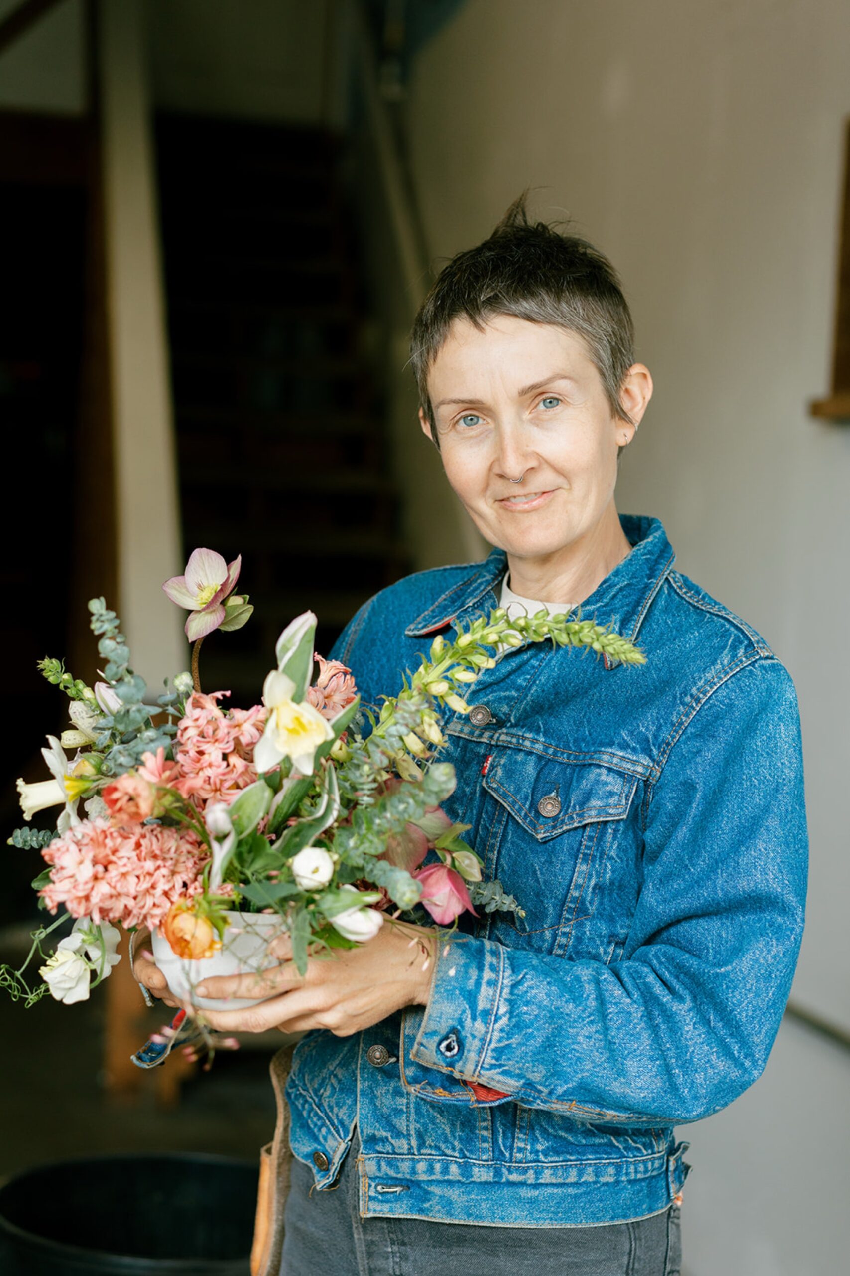 kelly brown with do right flower farm holding a bouqyet they made